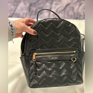 Gently used NINE WEST BLACK BACKPACK with many places to hold things.